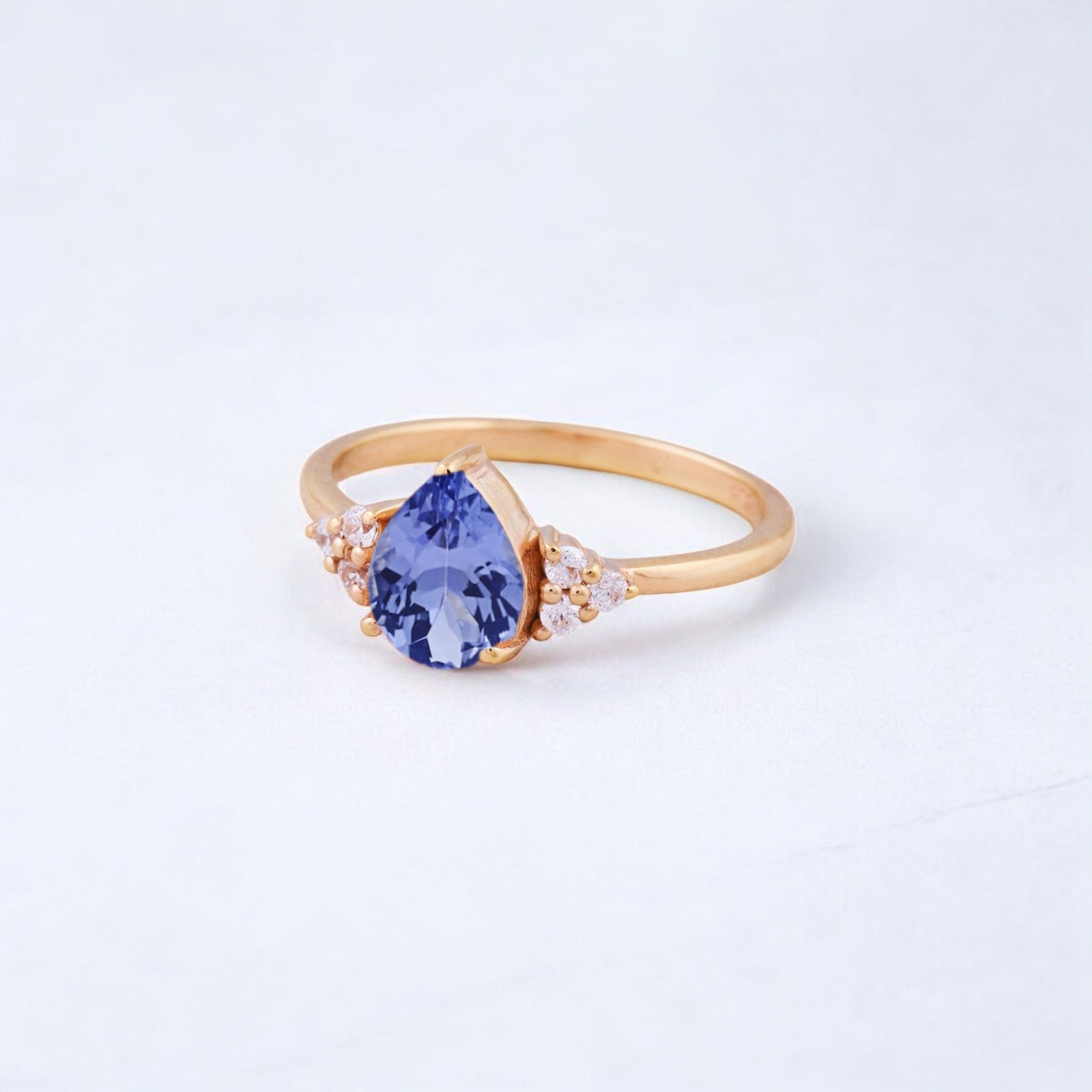 14K White Gold Tanzanite Engagement Promise Ring For Women December Birthstone Jewelry Anniversary Gift For Her CZ Diamond Ring Tanzanite Proposal Ring: A Unique & Meaningful Symbol of Love 💜✨ A Tanzanite Proposal Ring is an elegant and rare choice, perfect for those who want a distinctive alternative to traditional diamond rings. With its stunning blue-violet hues, tanzanite represents love, transformation, and new beginnings, making it an ideal gemstone for a heartfelt proposal. Why Choose a Tanzanite Proposal Ring? ✅ Symbol of Deep Love & Commitment – Tanzanite is believed to strengthen emotional connections and bring harmony to relationships. ✅ Rare & Unique – Found only in Tanzania, tanzanite is a rare and precious gemstone, making it a one-of-a-kind engagement ring choice. ✅ December Birthstone – Perfect for those born in December or for anyone who loves its vibrant blue-purple shades. ✅ Elegant Alternative to Traditional Diamonds – Ideal for those who want a colorful and meaningful engagement ring. Tanzanite in Jewelry & Styling 💎 Accented with CZ Diamonds – Enhances brilliance and adds a touch of sparkle. 💍 Set in 14K White Gold, Yellow Gold, or Rose Gold – Complements tanzanite’s rich hues beautifully. ✨ Looks Stunning in Vintage, Art Deco, and Modern Designs – Making it versatile for different styles. Perfect for Special Occasions 💍 Proposal & Engagement Rings – A meaningful choice for a lifelong commitment. 🎁 Anniversary & Birthday Gifts – Especially for December-born individuals. 💜 Promise Rings & Milestone Celebrations – Represents transformation and personal growth. Would you like tips on styling or caring for a tanzanite ring? 😊💍