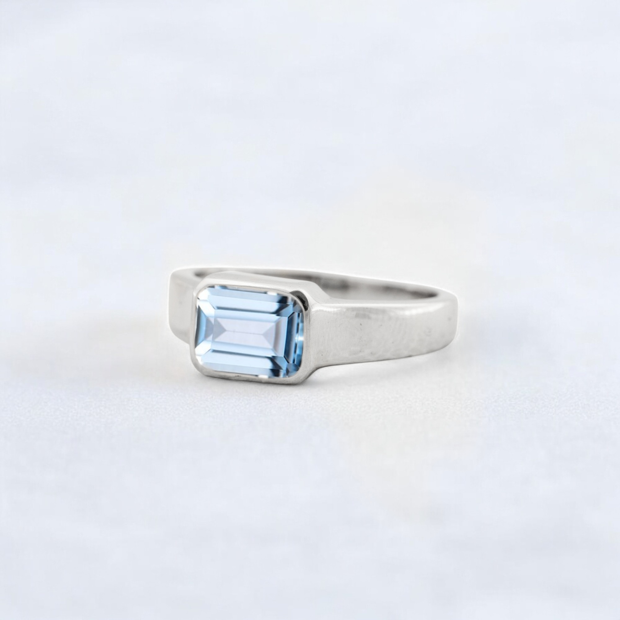 Solitaire Aquamarine Engagement Ring, Solid Gold Engagement Ring, Minimalist Statement Ring, Bezel Set Birthday Gift For Love ice blue bezel ring, sea-inspired solitaire, clean line gemstone ring, ocean energy ring, soft blue modern jewelry, tranquil blue stone ring, chic aquamarine piece, calming luxe ring, understated gemstone design, classic with a twist ring