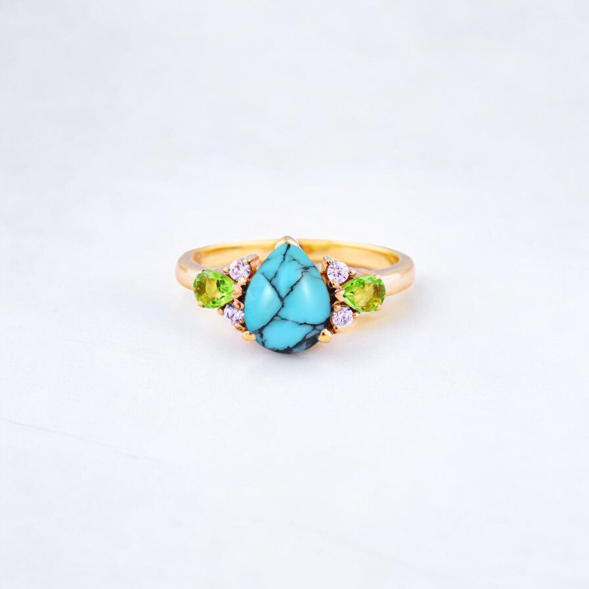 Pear Cut Turquoise Ring Art Deco Handmade Proposal Ring Peridot Alternative Cluster Women Jewelry CZ Diamond Gift Ring For Her Turquoise Ring for Women: A Symbol of Beauty, Protection & Love 💙✨ A turquoise ring is a timeless and meaningful piece of jewelry, known for its vibrant blue-green hues and rich cultural significance. Treasured for centuries, turquoise symbolizes protection, wisdom, and emotional balance, making it a perfect choice for women who appreciate both beauty and meaning in their jewelry. Why Choose a Turquoise Ring? ✅ Symbol of Love & Friendship – Turquoise has long been associated with strong relationships, loyalty, and positive energy. ✅ Protection & Healing – Believed to shield the wearer from negative energy and bring emotional stability. ✅ Unique & Eye-Catching – Each turquoise stone has a one-of-a-kind color and pattern, making every ring special. ✅ Alternative to Traditional Gemstones – A great choice for those who love bohemian, vintage, or artistic jewelry styles. Turquoise in Jewelry & Styling 💎 Accented with CZ Diamonds & Peridot – Enhances the brilliance and elegance of the ring. 💍 Perfect in Various Metal Settings – Looks stunning in gold, silver, and rose gold, complementing its striking blue tones. ✨ Art Deco & Handmade Designs – Adds a vintage and unique touch, making the ring stand out. Perfect for Special Occasions 🎁 Birthday & Holiday Gifts – A meaningful and stylish present for a loved one. 💍 Engagement & Promise Rings – A distinctive alternative to diamonds. 🎂 December Birthstone Jewelry – Ideal for those born in December. Would you like styling tips or care instructions for a turquoise ring? 😊💙