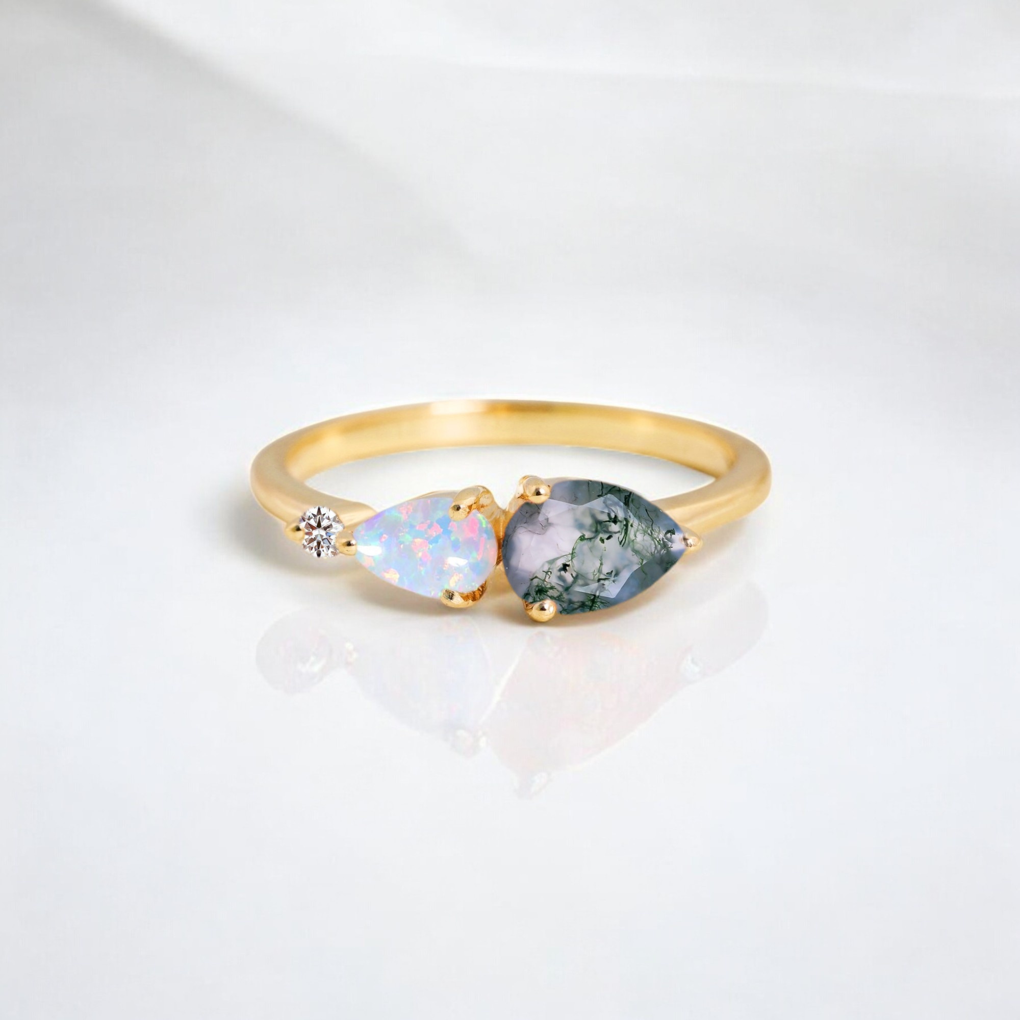 Natural Moss Agate Women Ring Fire Opal Diamond Wedding Ring Yellow Gold Handmade Jewelry Birthday Gift For Wife This Natural Moss Agate Engagement Ring is a stunning choice for a unique and meaningful proposal. The Moss Agate gemstone, with its beautiful green hues and earthy patterns, symbolizes growth, harmony, and new beginnings—making it the perfect stone for an engagement ring. Accented with luminous Opal, this ring adds an iridescent touch of elegance and charm. Crafted in 14K Yellow Gold, this ring exudes warmth and luxury, offering a timeless appeal that will be treasured forever. Whether as an Engagement Ring or a Proposal Ring, it’s an ideal alternative to traditional diamond jewelry, with its earthy, one-of-a-kind design. Perfect as an Anniversary Gift for your wife, this ring is a deeply personal piece of Personalized Jewelry that celebrates your love and connection. Its natural beauty and thoughtful craftsmanship make it a standout choice for those seeking something distinctive and meaningful to mark a special occasion.