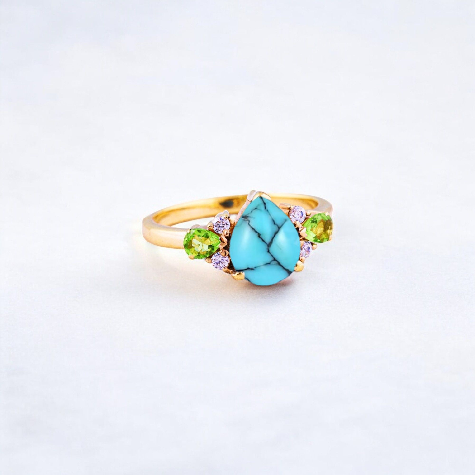 Pear Cut Turquoise Ring Art Deco Handmade Proposal Ring Peridot Alternative Cluster Women Jewelry CZ Diamond Gift Ring For Her Turquoise Ring for Women: A Symbol of Beauty, Protection & Love 💙✨ A turquoise ring is a timeless and meaningful piece of jewelry, known for its vibrant blue-green hues and rich cultural significance. Treasured for centuries, turquoise symbolizes protection, wisdom, and emotional balance, making it a perfect choice for women who appreciate both beauty and meaning in their jewelry. Why Choose a Turquoise Ring? ✅ Symbol of Love & Friendship – Turquoise has long been associated with strong relationships, loyalty, and positive energy. ✅ Protection & Healing – Believed to shield the wearer from negative energy and bring emotional stability. ✅ Unique & Eye-Catching – Each turquoise stone has a one-of-a-kind color and pattern, making every ring special. ✅ Alternative to Traditional Gemstones – A great choice for those who love bohemian, vintage, or artistic jewelry styles. Turquoise in Jewelry & Styling 💎 Accented with CZ Diamonds & Peridot – Enhances the brilliance and elegance of the ring. 💍 Perfect in Various Metal Settings – Looks stunning in gold, silver, and rose gold, complementing its striking blue tones. ✨ Art Deco & Handmade Designs – Adds a vintage and unique touch, making the ring stand out. Perfect for Special Occasions 🎁 Birthday & Holiday Gifts – A meaningful and stylish present for a loved one. 💍 Engagement & Promise Rings – A distinctive alternative to diamonds. 🎂 December Birthstone Jewelry – Ideal for those born in December. Would you like styling tips or care instructions for a turquoise ring? 😊💙