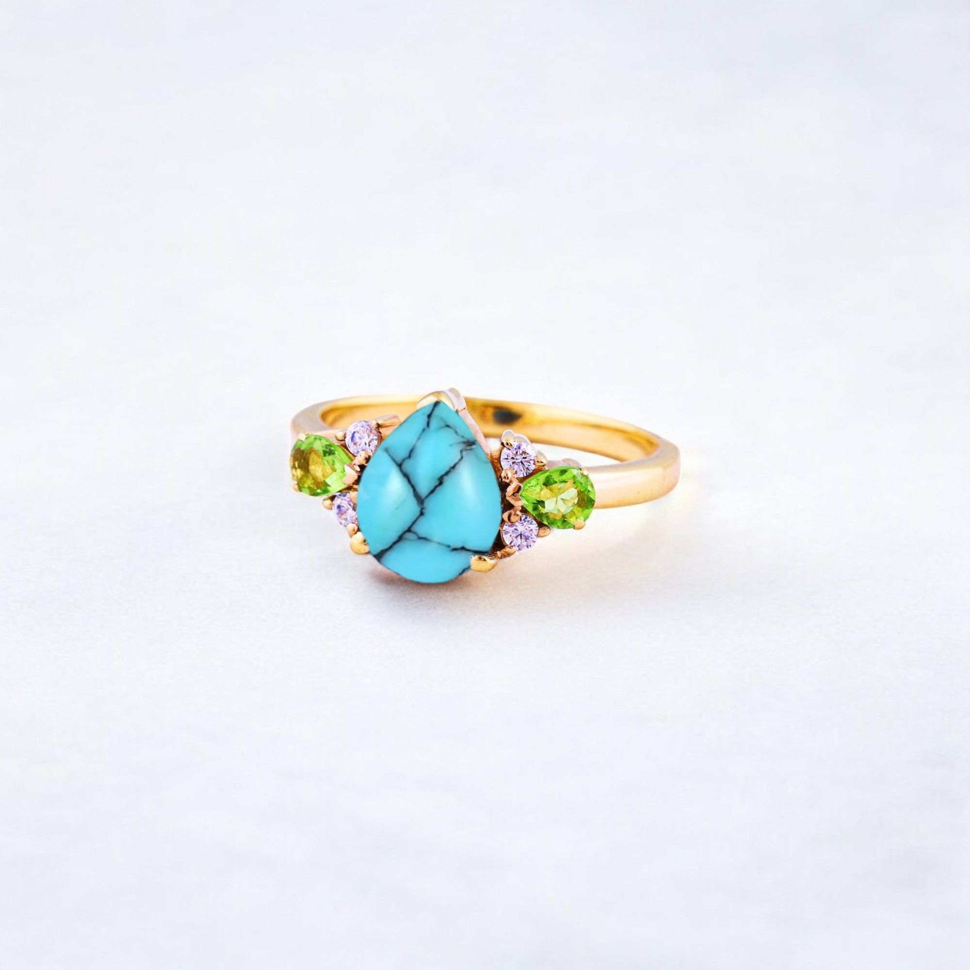 Pear Cut Turquoise Ring Art Deco Handmade Proposal Ring Peridot Alternative Cluster Women Jewelry CZ Diamond Gift Ring For Her Turquoise Ring for Women: A Symbol of Beauty, Protection & Love 💙✨ A turquoise ring is a timeless and meaningful piece of jewelry, known for its vibrant blue-green hues and rich cultural significance. Treasured for centuries, turquoise symbolizes protection, wisdom, and emotional balance, making it a perfect choice for women who appreciate both beauty and meaning in their jewelry. Why Choose a Turquoise Ring? ✅ Symbol of Love & Friendship – Turquoise has long been associated with strong relationships, loyalty, and positive energy. ✅ Protection & Healing – Believed to shield the wearer from negative energy and bring emotional stability. ✅ Unique & Eye-Catching – Each turquoise stone has a one-of-a-kind color and pattern, making every ring special. ✅ Alternative to Traditional Gemstones – A great choice for those who love bohemian, vintage, or artistic jewelry styles. Turquoise in Jewelry & Styling 💎 Accented with CZ Diamonds & Peridot – Enhances the brilliance and elegance of the ring. 💍 Perfect in Various Metal Settings – Looks stunning in gold, silver, and rose gold, complementing its striking blue tones. ✨ Art Deco & Handmade Designs – Adds a vintage and unique touch, making the ring stand out. Perfect for Special Occasions 🎁 Birthday & Holiday Gifts – A meaningful and stylish present for a loved one. 💍 Engagement & Promise Rings – A distinctive alternative to diamonds. 🎂 December Birthstone Jewelry – Ideal for those born in December. Would you like styling tips or care instructions for a turquoise ring? 😊💙
