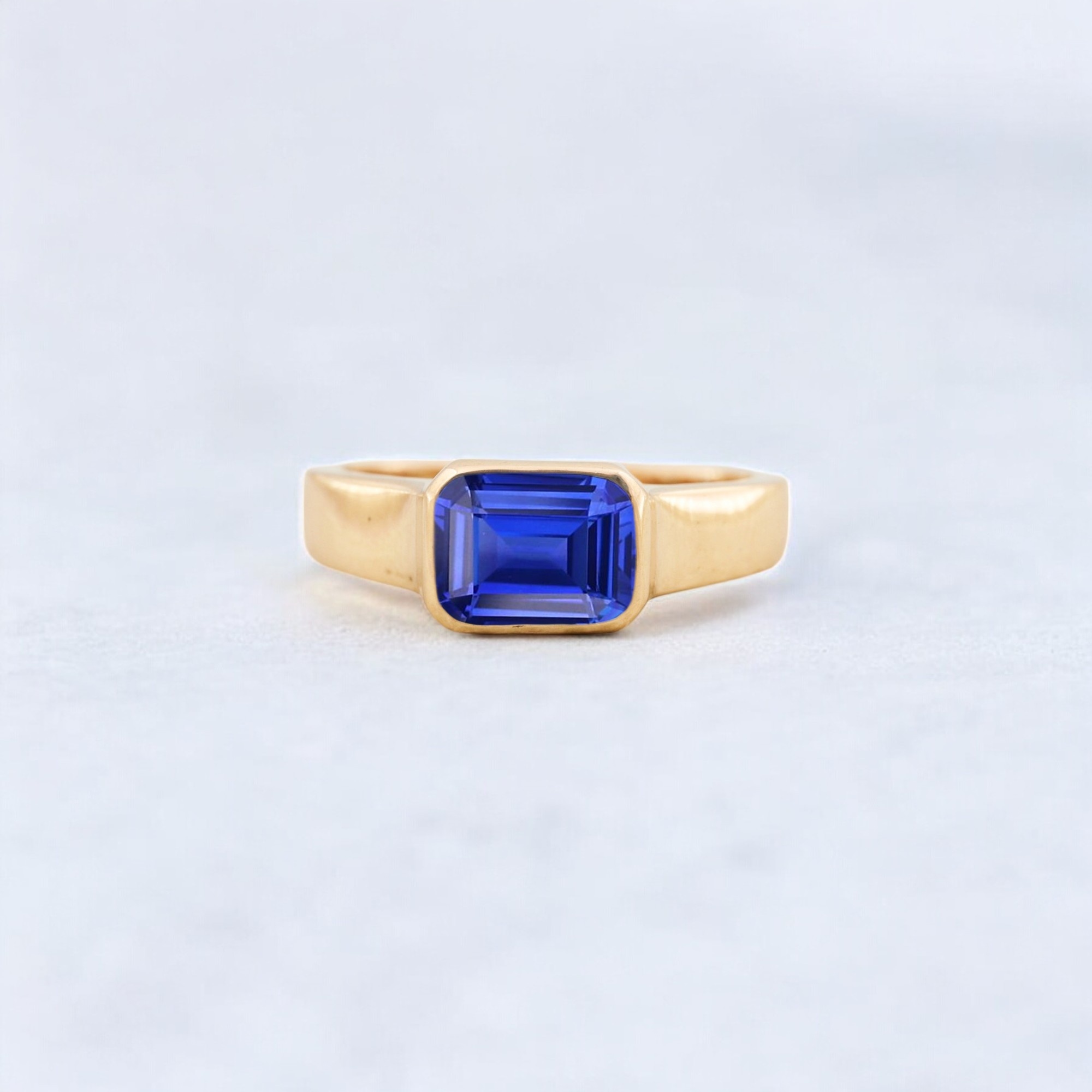 Emerald Cut Blue Sapphire Wedding Ring, Solitaire Bridal Jewelry, Solid Gold Engagement Ring deep ocean-hued gem, regal blue centerpiece, lab-grown sapphire brilliance, striking emerald silhouette, luxe indigo stone, geometric blue sparkle, sapphire solitaire glow, bold blue statement, lab sapphire radiance, rich azure shimmer, royal-toned gem, angular sapphire charm, sustainable blue gemstone, moody sapphire elegance, timeless blue solitaire, modern sapphire simplicity, bold-cut blue jewel, ocean-inspired glamour, contemporary sapphire piece