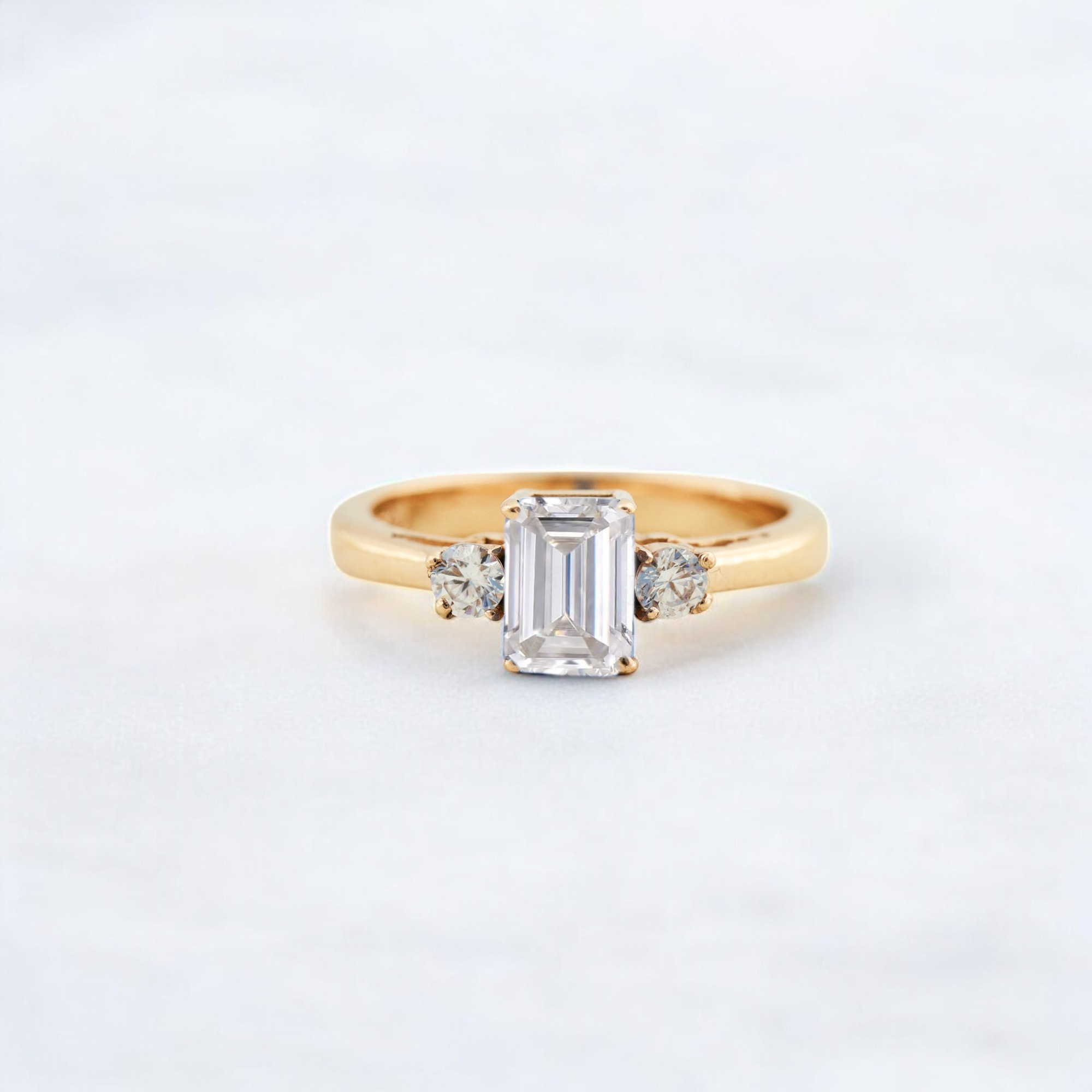 Emerald Cut Moissanite Wedding Ring Bridal Promise Stacking Ring Unique Design Statement Ring Yellow old Gift Jewelry This Emerald Cut Moissanite Wedding Ring features a stunning Moissanite stone that sparkles with unparalleled brilliance. The emerald cut of the Moissanite adds a touch of sophistication and elegance to this timeless design. Set in yellow gold, the ring exudes warmth, making it a perfect choice for those who appreciate classic luxury. Paired with a matching promise stacking ring, this set can be worn together or separately for a personalized look. The unique design of this set ensures that it will stand out, making it a bold statement piece. Perfect as a wedding ring or bridal jewelry, this set symbolizes love, commitment, and timeless elegance. Handcrafted with meticulous attention to detail, this ring set showcases superior craftsmanship. Moissanite is known for its incredible brilliance, offering a sparkle that rivals diamonds at a more affordable price.