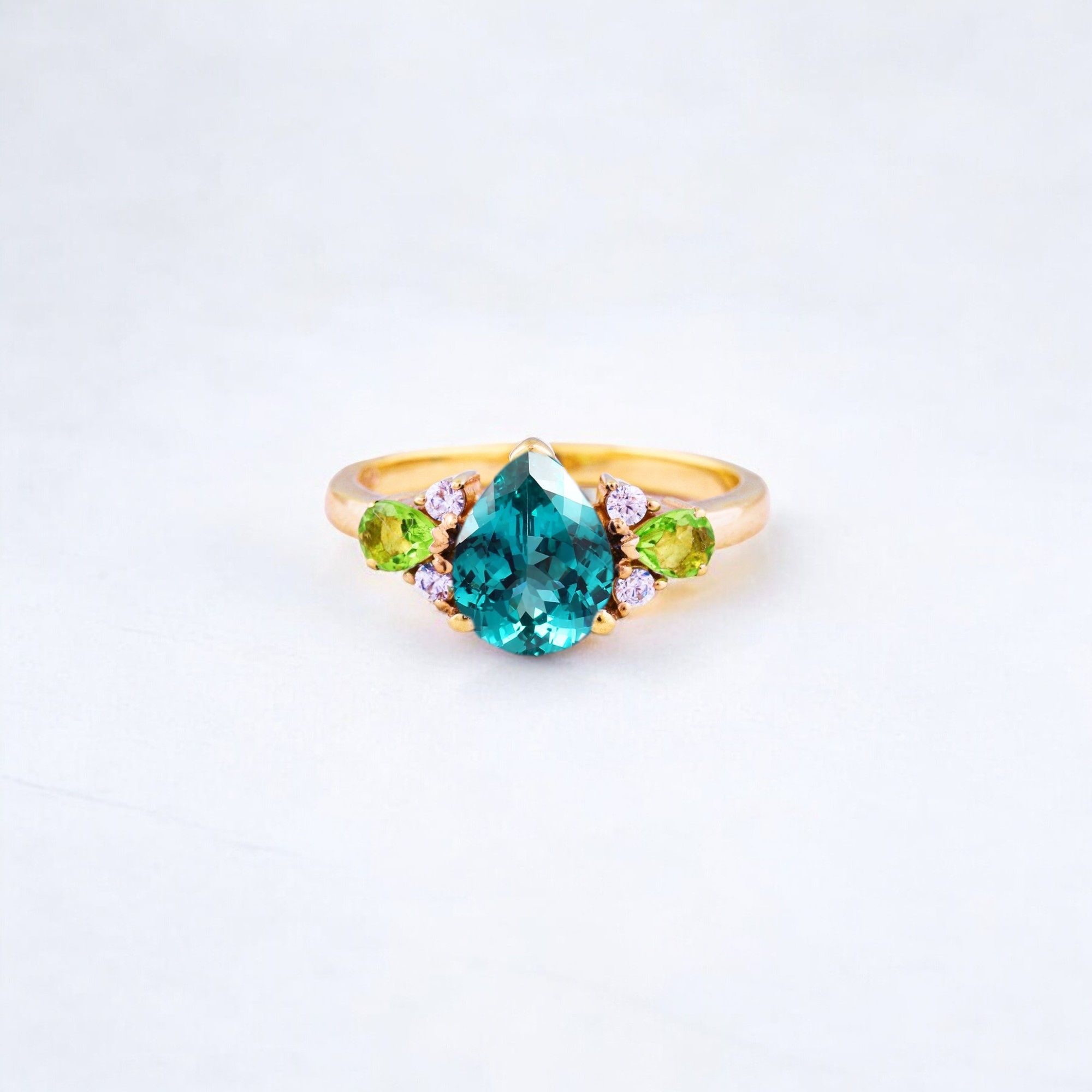 Pear Cut Emerald Promise Ring Peridot Cluster Bridal Wedding Jewelry CZ Diamond Ring May Birthstone Gift Ring Benefits of Emerald Stone 💚✨ Emerald, the mesmerizing green gemstone, is cherished not only for its beauty but also for its spiritual, emotional, and physical benefits. It is the birthstone of May and has been regarded as a symbol of love, wisdom, and prosperity for centuries. 1. Emotional & Spiritual Benefits ✅ Enhances Love & Relationships – Known as the "Stone of Successful Love," emerald is believed to strengthen relationships and bring harmony in marriage. ✅ Boosts Confidence & Communication – Helps in self-expression, making it ideal for those who struggle with communication. ✅ Promotes Inner Peace & Mental Clarity – Reduces stress, anxiety, and emotional instability while enhancing wisdom and intuition. 2. Health Benefits ✅ Improves Eye Health – Ancient beliefs suggest emeralds help with vision and eye-related issues. ✅ Strengthens the Heart & Immune System – Some believe wearing emeralds can improve overall physical well-being. ✅ Aids in Emotional Healing – Encourages positivity, emotional balance, and reduces negative energy. 3. Financial & Career Benefits ✅ Attracts Wealth & Prosperity – Emerald is associated with financial success and abundance. ✅ Enhances Creativity & Intelligence – Beneficial for writers, artists, and professionals in creative fields. ✅ Brings Good Luck & New Opportunities – Many believe emeralds help in career growth and decision-making. Who Should Wear an Emerald? People born in May (as their birthstone) Those seeking love, emotional balance, or success Students, business professionals, and creatives looking for clarity and inspiration Anyone wanting a unique and powerful gemstone in their jewelry collection Would you like guidance on how to choose the best emerald or care for it? 😊💚