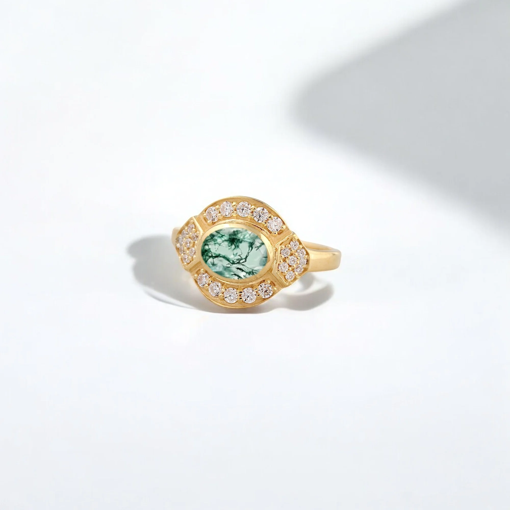 Oval Cut Moss Agate Diamond Halo Gold Engagement Ring for Her – Unique Handcrafted Bridal Jewelry Oval moss agate and diamond halo ring Moss agate gold engagement ring for her Unique handcrafted moss agate bridal ring Nature-inspired diamond engagement ring Green moss agate statement ring Organic gemstone halo bridal jewelry